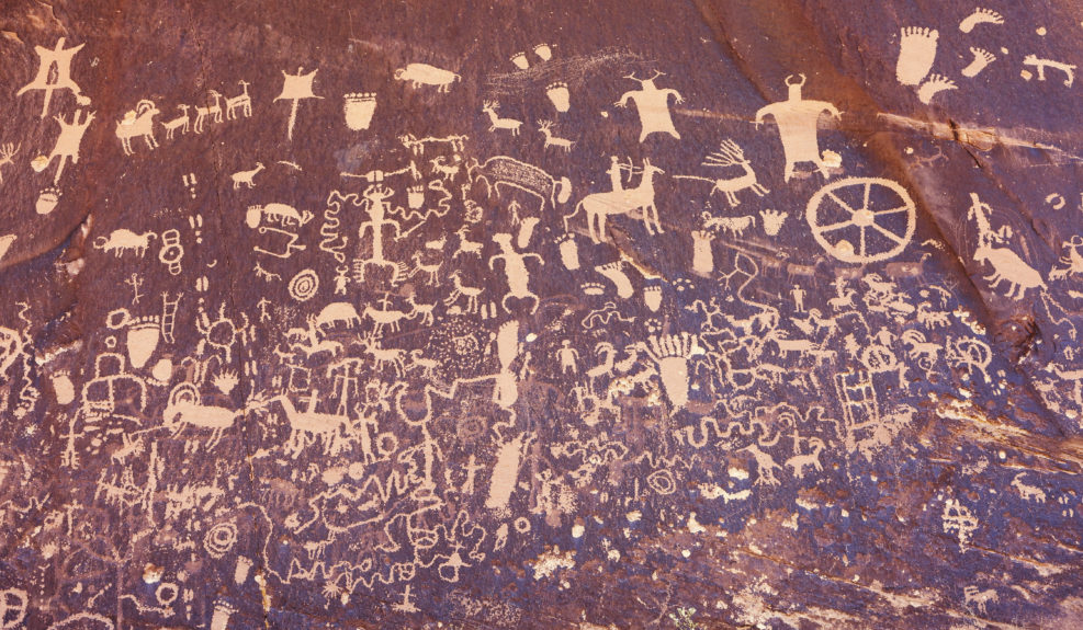 Ancient symbols texture, Petroglyphs on Newspaper Rock, Utah, USA.